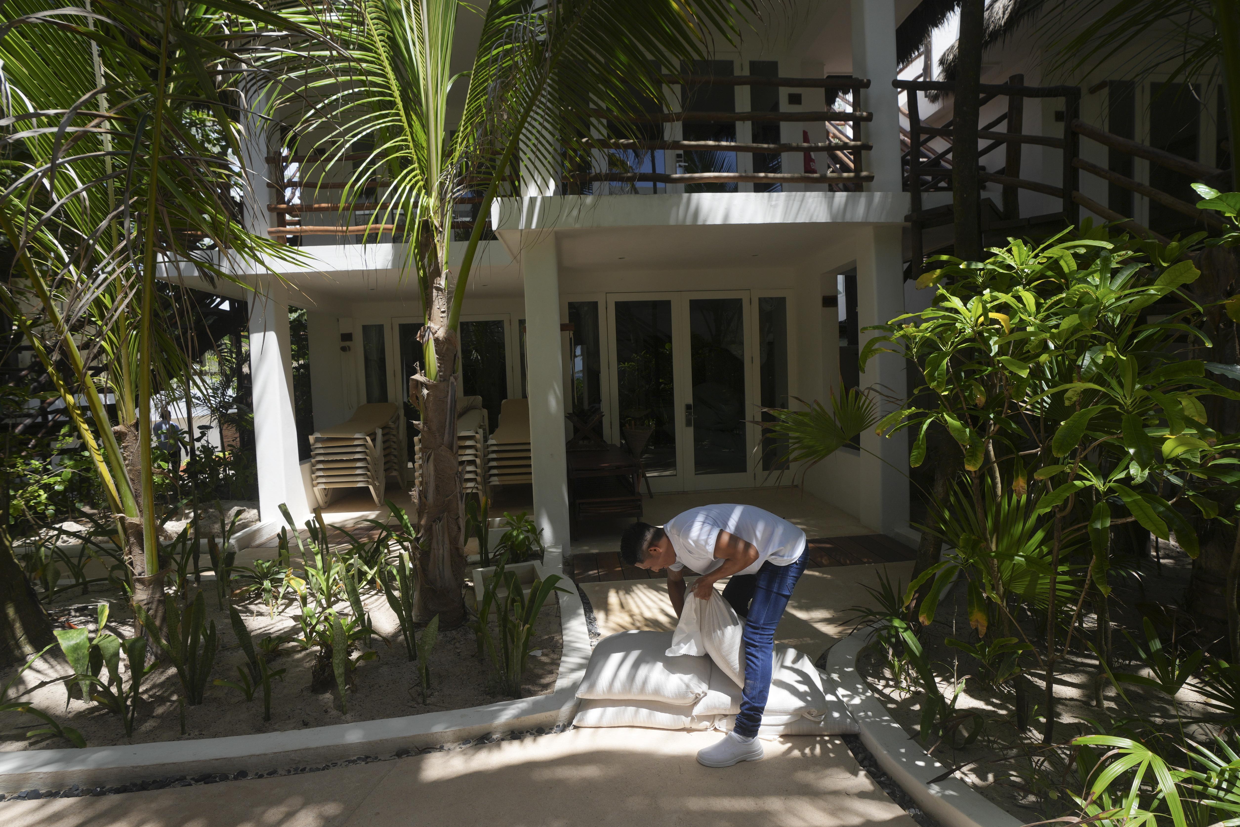 Hurricane Beryl made landfall on Mexico's coast near the resort of Tulum as a Category 2 storm early Friday after leaving a trail of destruction across the eastern Caribbean.