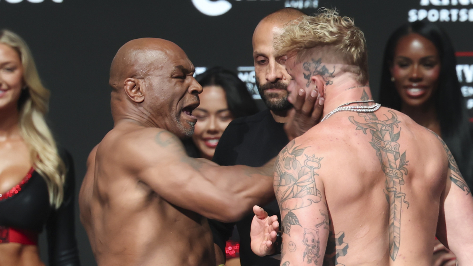 The fireworks are starting early between Mike Tyson and Jake Paul. On Thursday, Tyson and Paul hit the scales for the official weigh-in ahead of their highly-anticipated fight on Friday that will be streamed live on Netflix.